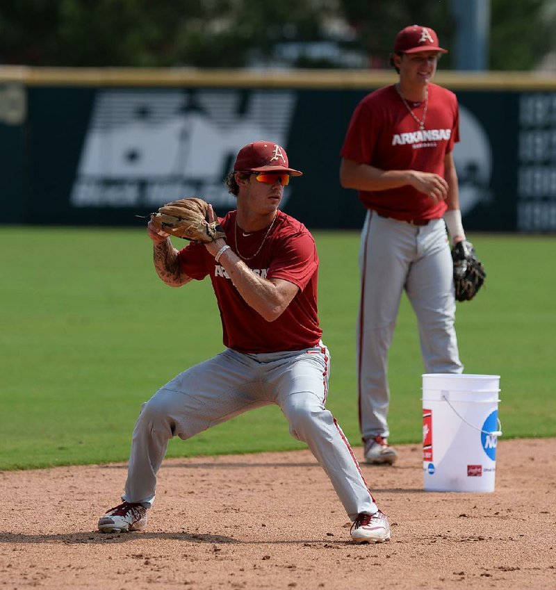 Arkansas junior shortstop Casey Martin (center) will be out for the rest of fall practice after breaking a bone in his hand. Martin had surgery on his left, nonthrowing hand Monday and is expected to be able to swing a bat again in 4-5 weeks.