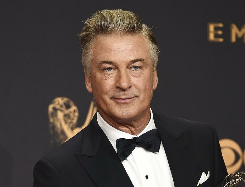 In this Sept. 17, 2017 file photo, Alec Baldwin poses in the press room with the award for outstanding supporting actor in a comedy series for "Saturday Night Live" at the 69th Primetime Emmy Awards in Los Angeles.