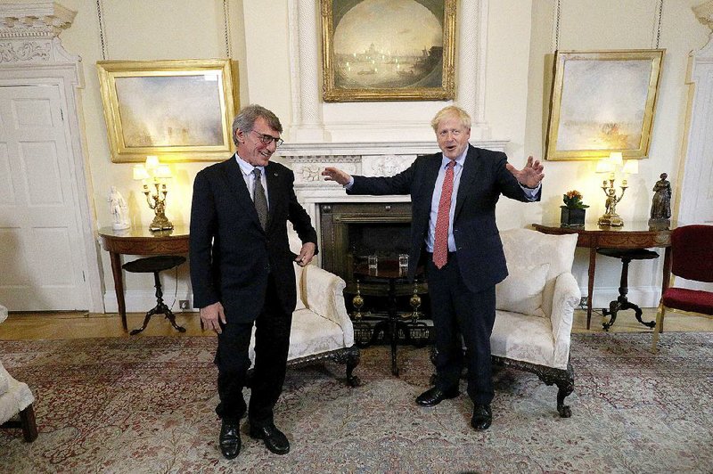 British Prime Minister Boris Johnson (right) talks with David Sassoli, the president of the European Parliament, ahead of a private meeting Tuesday at No. 10 Downing St. in London. More photos are available at arkansasonline.com/109johnson/ 