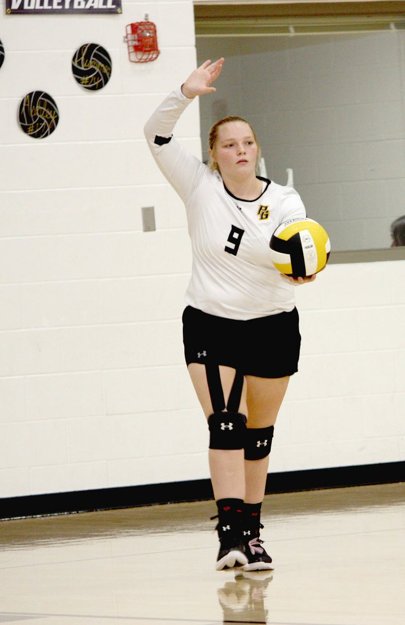 MARK HUMPHREY ENTERPRISE-LEADER Prairie Grove junior Madison Hutchison prepares to serve during the Lady Tigers' 3-1 win over Gravette on Tuesday, Sept. 17, 2019. Prairie Grove claimed victory in four sets by scores of 25-19, 25-20, 17-25, 25-20.