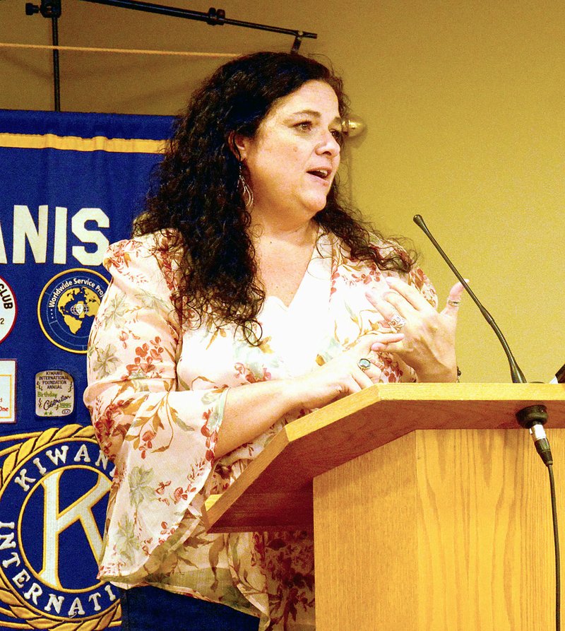 Janelle Jessen/Herald-Leader Sunny Lane, director of development for the Helen R. Walton Children's Enrichment Center, spoke to Siloam Springs Kiwanis Club members on Wednesday about the importance of early childhood interactions during the club's launch of the Dolly Parton Imagination Library in Siloam Springs.