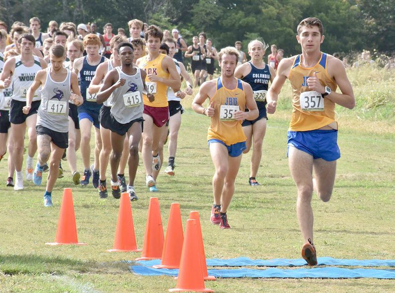 Photo courtesy of JBU Sports Information John Brown junior Ben Martin runs with teammate freshman River Baker right behind during last Saturday's Show Me State Showdown hosted by Columbia (Mo.) College.
