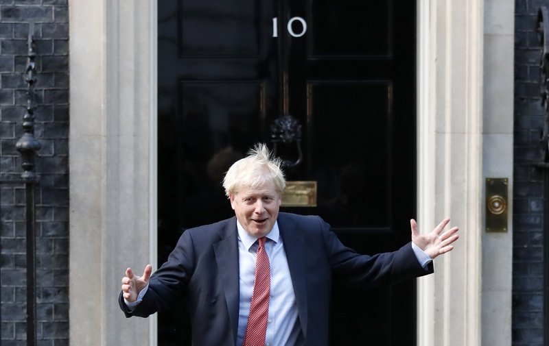 Britain's Prime Minister Boris Johnson leaves 10 Downing Street to welcome the President of the European Parliament David Sassol in London, Tuesday, Oct. 8, 2019.(AP Photo/Frank Augstein) story.lead_photo.caption
