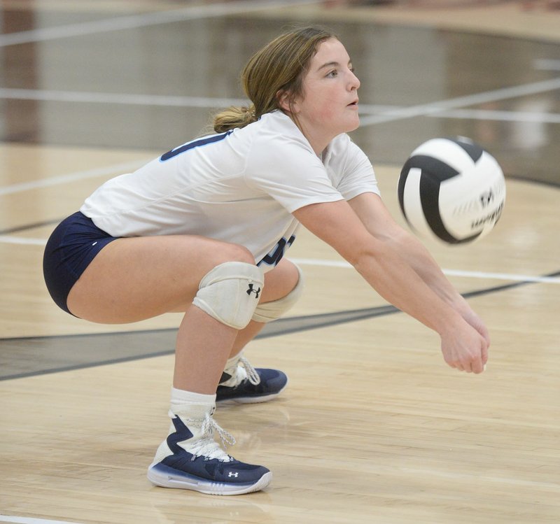 NWA Democrat-Gazette/ANDY SHUPE Har-Ber's Maddux McCrackin digs a ball Tuesday, Oct. 8, 2019, during play against Springdale at Springdale High School. Visit nwadg.com/photos to see more photographs from the match.