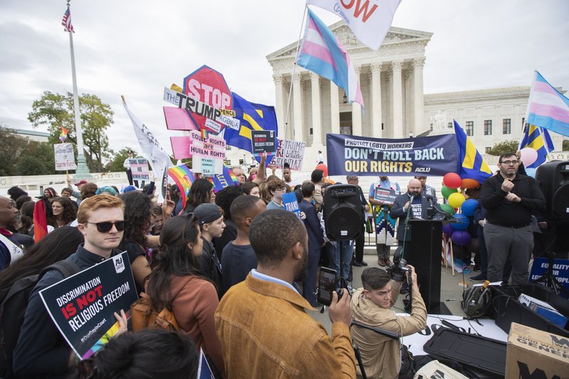 LGBT supporters gather in front of the U.S. Supreme Court, Tuesday, Oct. 8, 2019, in Washington. The Supreme Court is set to hear arguments in its first cases on LGBT rights since the retirement of Justice Anthony Kennedy. Kennedy was a voice for gay rights while his successor, Brett Kavanaugh, is regarded as more conservative. (AP Photo/Manuel Balce Ceneta) story.lead_photo.caption