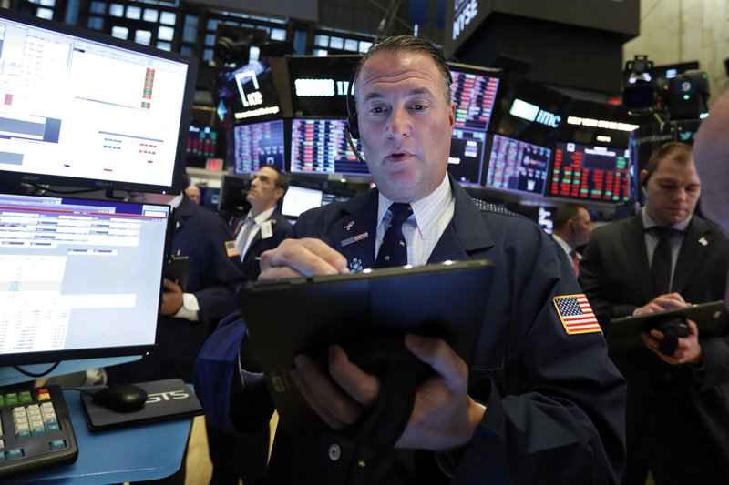 Trader Jonathan Corpina works on the floor of the New York Stock Exchange, Tuesday, Oct. 8, 2019. Stocks are opening lower on Wall Street as tensions rose between Washington and Beijing just ahead of the latest round of trade talks. (AP Photo/Richard Drew)