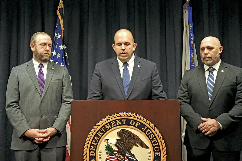 Duane "DAK" Kees (center), U.S. attorney for the Western District of Arkansas, speaks Tuesday as Clay Fowlkes (left), first assistant U.S. attorney for the Western District of Arkansas, and Justin King, assistant special agent in charge of the Drug Enforcement Administration in Arkansas, listen during a news conference Tuesday in Fort Smith.