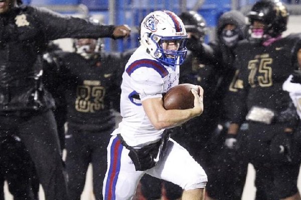 Arkadelphia quarterback Cannon Turner breaks free on a 69-yard touchdown run during the Badgers’ 28-0 victory over Joe T. Robinson in Saturday night’s Class 4A championship game at War Memorial Stadium in Little Rock.