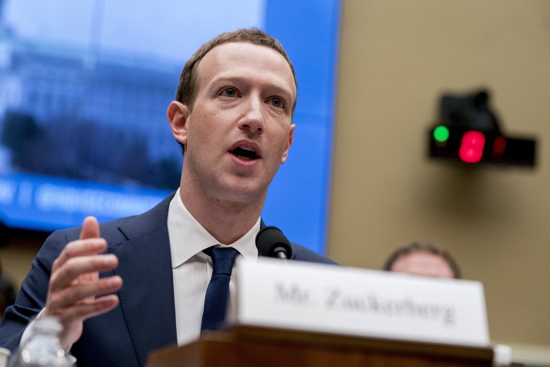FILE - In this April 11, 2018, file photo, Facebook CEO Mark Zuckerberg testifies before a House Energy and Commerce hearing on Capitol Hill in Washington about the use of Facebook data to target American voters in the 2016 election and data privacy. Attorney General William Barr wants Facebook to give law enforcement a way to read encrypted messages sent by users, re-igniting tensions between tech companies and law enforcement. (AP Photo/Andrew Harnik, File)