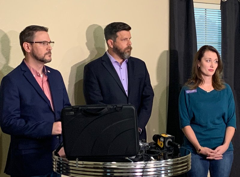 NWA Democrat-Gazette/MARY JORDAN Josh Bryant, nonprofit attorney, (from left), Justin Heimer, adoption attorney and Michaela Montie, executive director of Shared Beginnings, at a press conference at Shared Beginnings in Fayetteville.