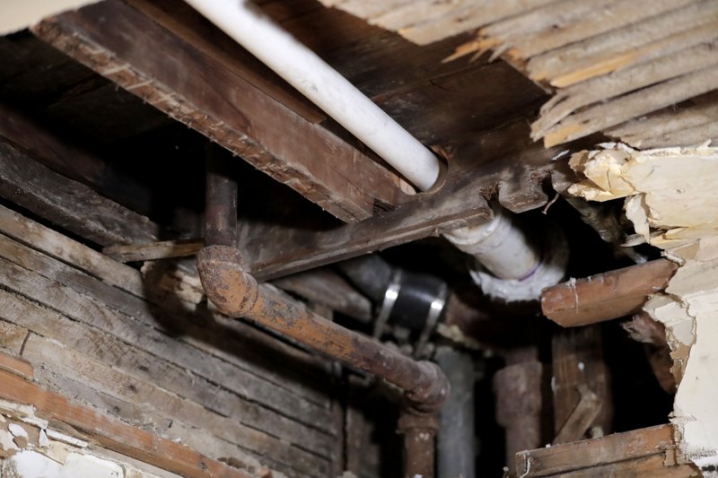 The Associated Press LEAD PIPES: In this Nov. 8, 2018, file photo, a lead pipe, left, is seen in a hole the kitchen ceiling in the home of Desmond Odom, in Newark, N.J. The Trump administration is proposing a rewrite of rules for dealing with lead pipes contaminating drinking water, but critics say the changes appear to give water systems decades more time to replace pipes leaching dangerous amounts of toxic lead. Contrary to regulatory rollbacks in many other environmental areas, the administration has called dealing with lead contamination in drinking water a priority.