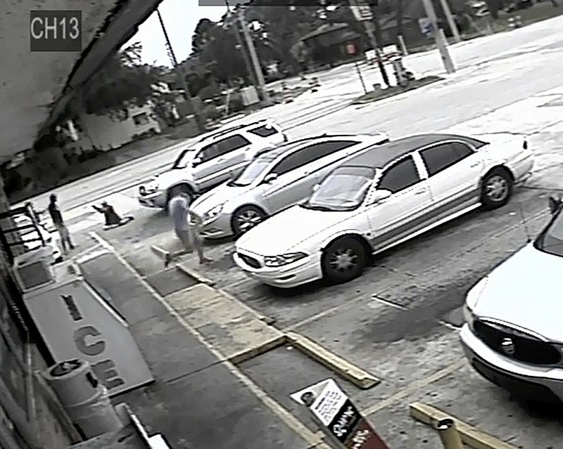 FILE - In this Thursday, July 19, 2018 file image taken from surveillance video released by the Pinellas County Sheriff's Office, Markeis McGlockton, far left, is shot by Michael Drejka during an altercation in the parking lot of a convenience store in Clearwater, Fla. Drejka, of Florida, who told detectives that he was irritated by people who illegally park in handicapped spots will be sentenced Thursday, Oct. 10, 2019, in the fatal shooting of McGlockton, an unarmed black man outside a convenience store. A jury found him guilty of manslaughter in August. (Pinellas County Sheriff's Office via AP, File)