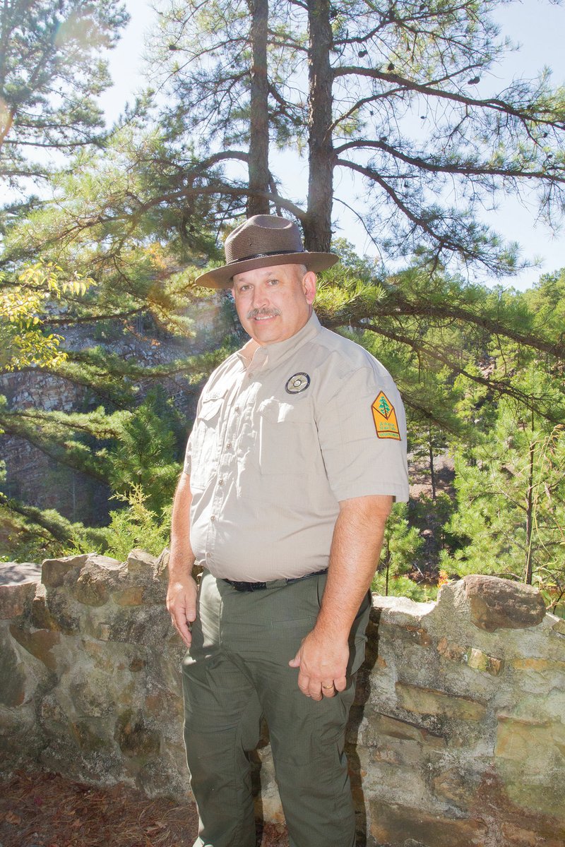 Ed Thomas of Mountain View stands on a trail near the visitor center at Pinnacle Mountain State Park, near Little Rock. Thomas was named the emergency services program coordinator for the Arkansas State Parks in July. He is in charge of security for all 52 state parks in Arkansas.