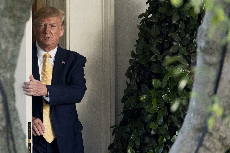 President Donald Trump leaves the Oval Office on Friday to board Marine One on his way to a campaign rally in Lake Charles, La., where he again attacked the House impeachment inquiry and former Vice President Joe Biden and Biden’s son, Hunter.