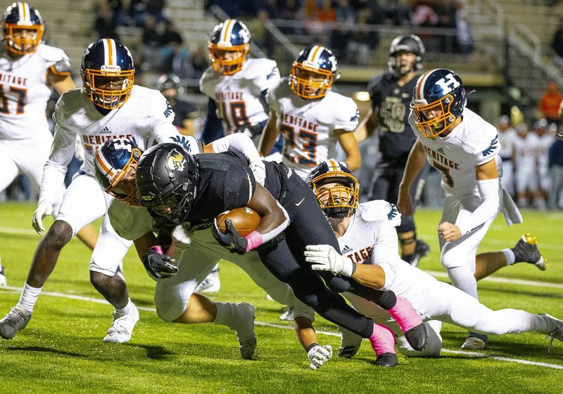 ROGERS HERITAGE VS BENTONVILLE - Preston Crawford (1) of Bentonvilled is surrounded by Heritage defenders at Tiger Stadium, Bentonville, AR, on Friday October 11 2019, Special to NWA Democrat-Gazette/ David Beach