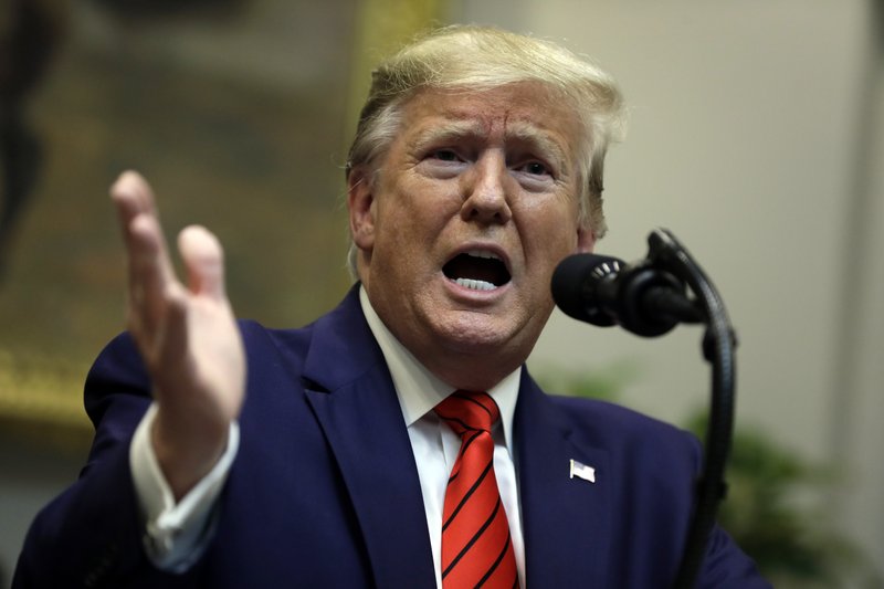 President Donald Trump answers questions from reporters during an event on &quot;transparency in Federal guidance and enforcement&quot; in the Roosevelt Room of the White House, Wednesday, Oct. 9, 2019, in Washington. (AP Photo/Evan Vucci)