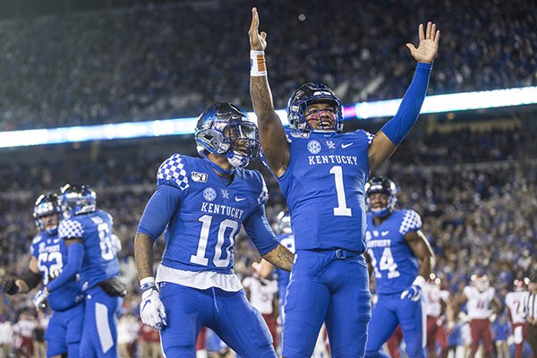 Kentucky quarterback Lynn Bowden Jr. celebrates after scoring a touchdown during the second quarter of a game against Arkansas on Saturday, Oct. 12, 2019, in Lexington, Ky. 