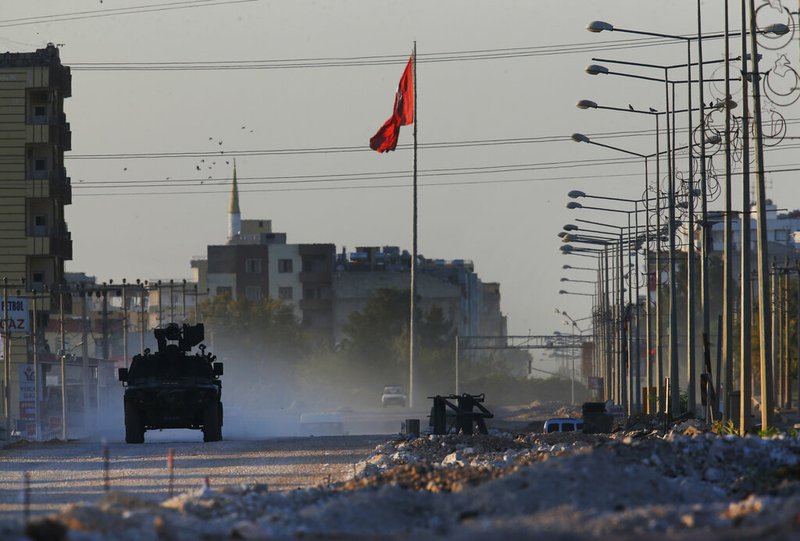 A Turkish police armored vehicle patrols the town of Akcakale, Sanliurfa province, southeastern Turkey, at the border with Syria, Saturday, Oct. 12, 2019. The towns along Turkey's border with northeastern Syria have been on high alert after dozens of mortars fired from Kurdish-held Syria landed, killing several civilians. 