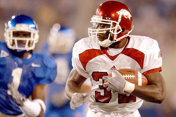 Arkansas running back DeCori Birmingham runs during a game against Kentucky on Saturday, Nov. 1, 2003, in Lexington, Ky. Birmingham rushed for 196 yards as the Razorbacks defeated the Wildcats 71-63 in seven overtimes.