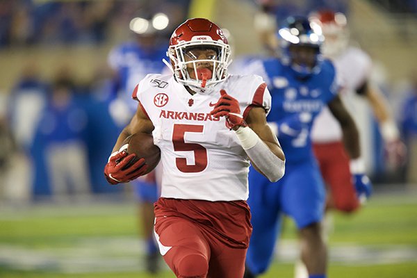 Arkansas running back Rakeem Boyd (5) runs for a touchdown during the first quarter of a game against Kentucky on Saturday, Oct. 12, 2019, in Lexington, Ky. 