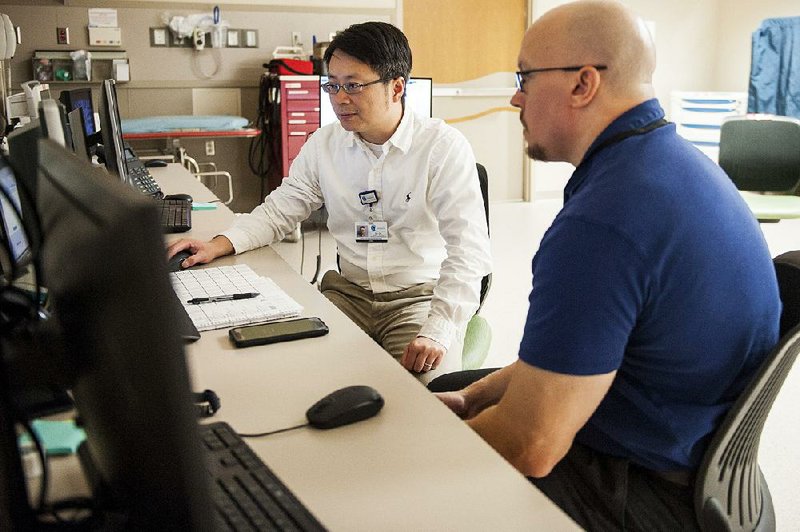 Xiawei Ou (left) and Ashley Acheson of Arkansas Children’s Research Institute will lead a team study into the effects of opioids on children in the womb using magnetic resonance imaging of babies’ brains. “It’s a very ambitious and difficult project, but I think it’s an important one,” said Acheson, an associate professor of psychiatry at the University of Arkansas for Medical Sciences. 