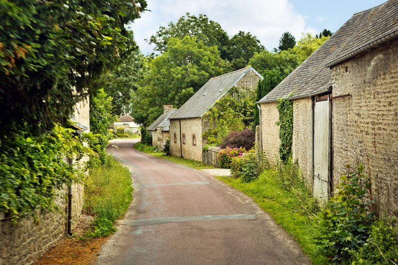 Normandy's little lanes, cute stone houses, and lush greenery are irresistible. (Photo by Dominic Arizona Bonuccelli via Rick Steves' Europe)