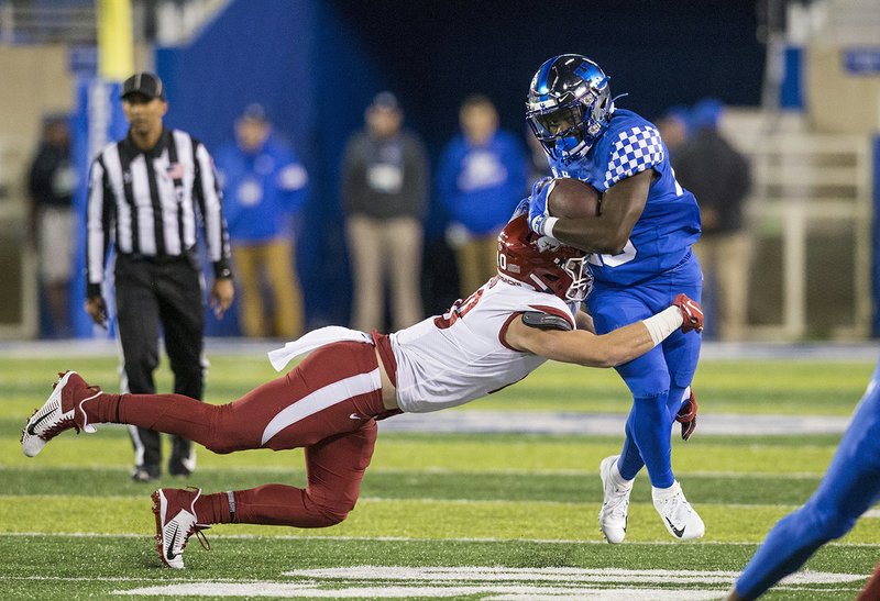 Arkansas linebacker Bumper Pool tackles Kentucky running back Kavosiey Smoke in the first quarter of Saturday's game at Kroger Field in Lexington, Ky. Photo by Ben Goff of NWA Democrat-Gazette