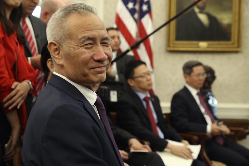 Chinese Vice Premier Liu He listens during a meeting in the Oval Office of the White House with President Donald Trump on Friday in Washington. - AP Photo/Andrew Harnik