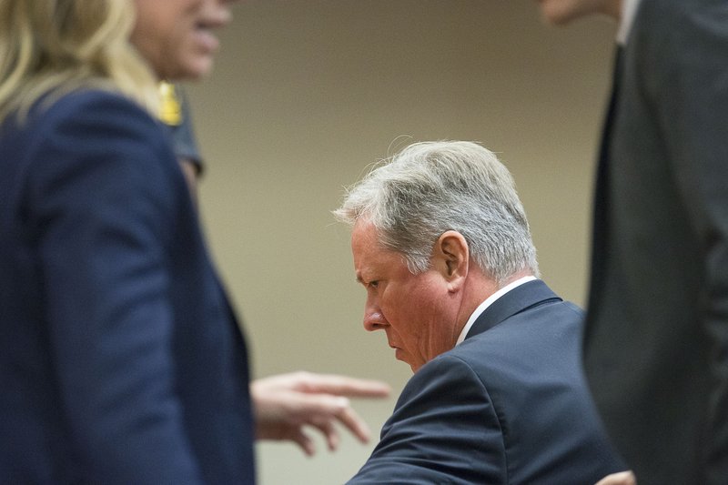 Robert "Chip" Olsen waits for DeKalb County Superior Court Judge LaTisha Dear Jackson to decide on when his sentencing will be given at the DeKalb County Courthouse in Decatur, Ga., Monday, Oct. 14, 2019. Olsen, a former Georgia police officer who fatally shot an unarmed, naked man, was found not guilty of murder on Monday, but was convicted of aggravated assault and other charges that could potentially send him to prison for more than 30 years. (Alyssa Pointer/Atlanta Journal-Constitution via AP, Pool)