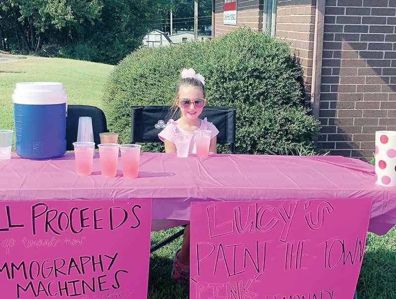 Lucy Ford, 6, of Batesville sells lemonade outside her father’s insurance company, Carter Ford State Farm Insurance. Lucy raised more than $1,700 for the Paint the Town Pink initiative, sponsored by the White River Health System Foundation.