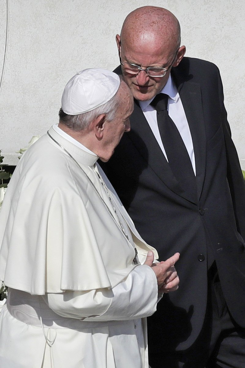 Vatican head of security Domenico Giani, right, shares a word with Pope Francis at the end of a canonization Mass in St. Peter's Square at the Vatican, Sunday, Oct. 13, 2019. The Vatican said Monday Oct. 14, 2019 that Francis&#x2019; chief bodyguard Giani has resigned over the leak of a Vatican police flyer identifying five Holy See employees who were suspended as part of a financial investigation, adding that Giani bore no responsibility for the leak, but that he had resigned to ensure the serenity of the investigation and &#x201c;out of love for the church and faithfulness&#x201d; to the pope. (AP Photo/Alessandra Tarantino)