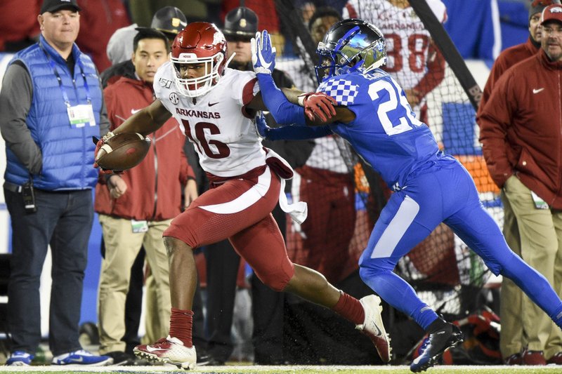 Arkansas wide receiver Treylon Burks (16) carries the ball Saturday, October 12, 2019 during the third quarter of a football game at Kroger Field in Lexington, Ky. Visit nwadg.com/photos to see more photographs from the game.
