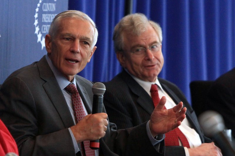 FILE — Wesley Clark, left, and Samuel Berger, former deputy National Security Advisor, talk about newly declassified documents on the role of intelligence during the 1992-1995 Balkan conflict during a 2013 symposium hosted by the Clinton Presidential Library.
