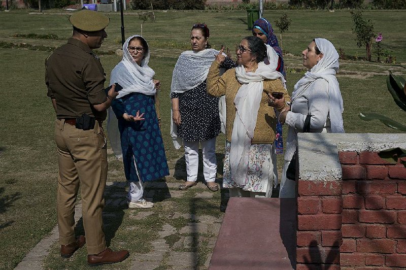 Kashmiri women argue with an Indian police officer Tuesday after they were stopped from staging a protest in Srinagar in India-controlled Kashmir. 