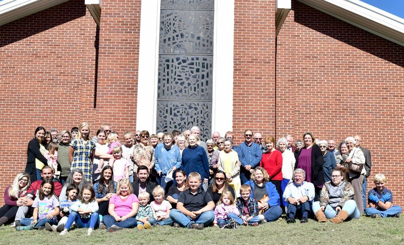 Westside Eagle Observer/MIKE ECKELS Members of the First Baptist Church of Decatur gather in front of their main sanctuary during the church's 150th anniversary celebration Oct. 12 in Decatur.