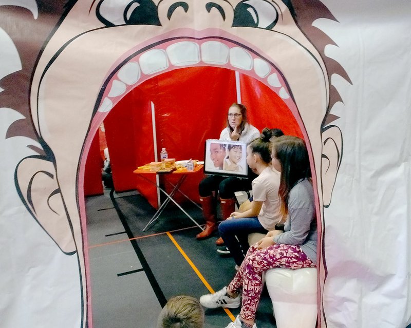 Lynn Atkins/The Weekly Vista For a group of Cooper Elementary students, the first stop on their way into the digestive system is the mouth where a volunteer talks about dental hygiene.