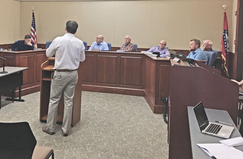 NWA Democrat-Gazette/MIKE JONES Bentonville's Planning Commission met Tuesday where members granted a permit for a Kasita boutique hotel. Planners also tabled a waiver for a shipping container park planned on land adjacent to the Walmart Supercenter on Walton Boulevard.