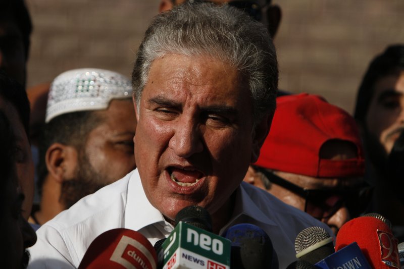 In this Friday Oct. 11, 2019 photo, Pakistan's Foreign Minister Shah Mahmood Qureshi speaks to reporters in Multan, Pakistan. (AP Photo/Asim Tanveer)