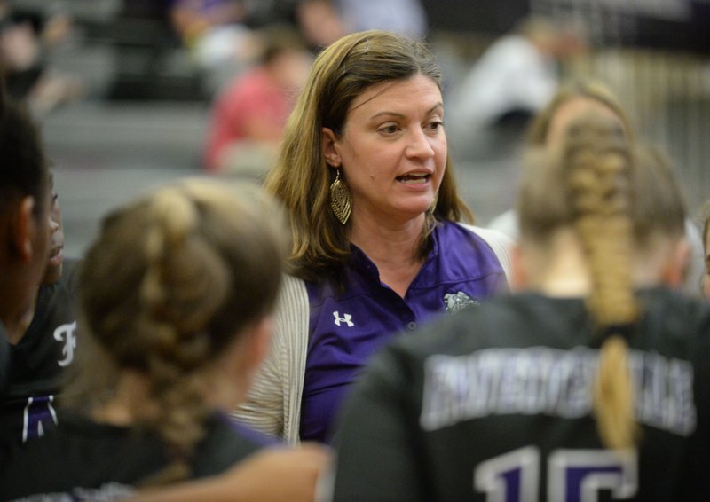 Fayetteville coach Jessica Phelan speaks to her team Tuesday, Sept. 17, 2019, during a timeout in Bulldog Arena in Fayetteville.