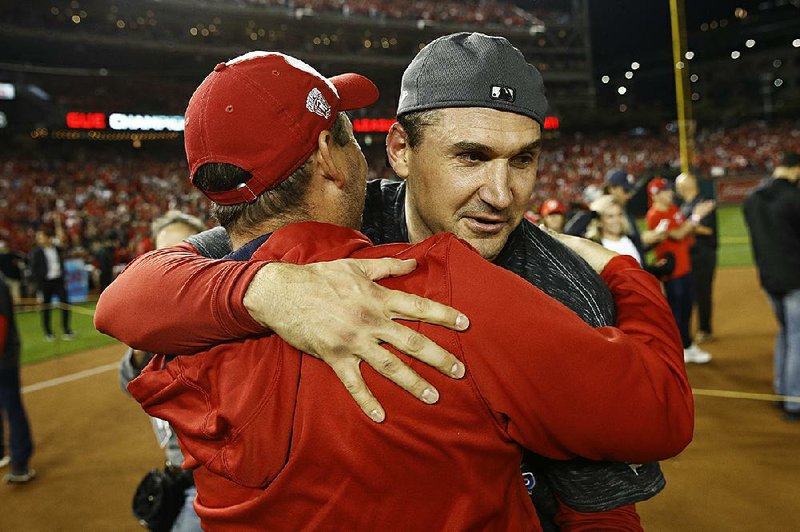 Washington first baseman Ryan Zimmerman (right) hugs Manager Dave Martinez after the Nationals defeated the St. Louis Cardinals 7-4 on Tuesday to sweep the National League Championship Series 4-0. Zimmerman, who was the first player drafted by the Nationals in 2005, has become the face of the franchise. “He’s put his heart and soul into this organization,” shortstop Trea Turner said. “He sacrificed a lot. And he’s given this organization a lot. For me, that speaks a lot about him and his family.” 