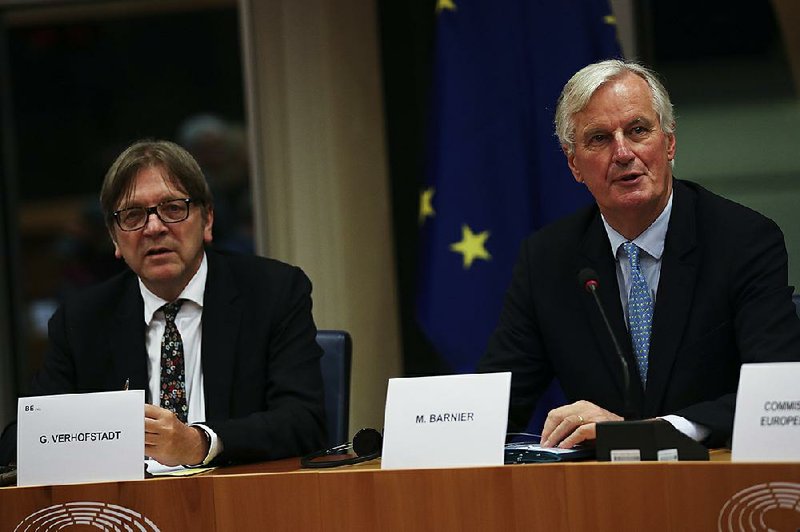 European Parliament Brexit chief Guy Verhofstadt (left) sits Wednesday beside European Union chief Brexit negotiator Michel Barnier during a Brexit Steering Group meeting at the European Parliament in Brussels. More photos are available at arkansasonline.com/1017eu/