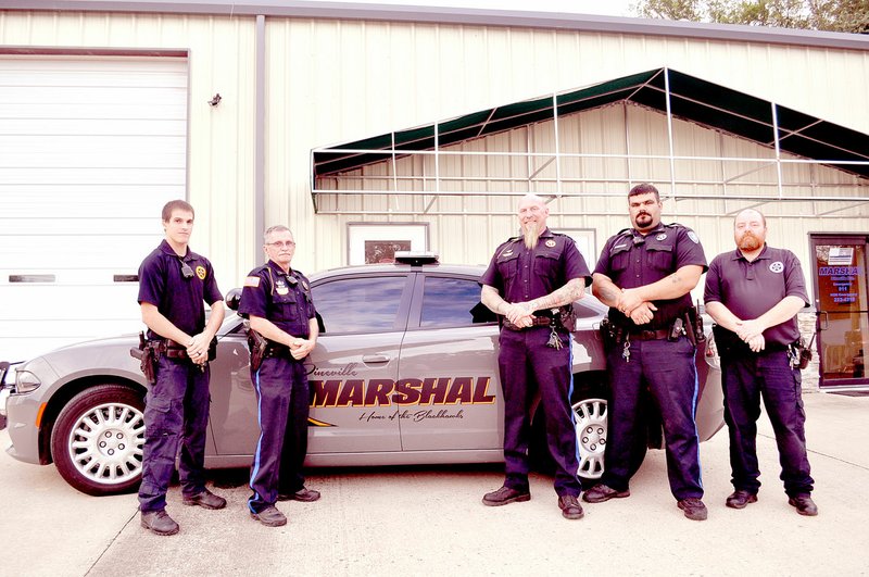 RACHEL DICKERSON/MCDONALD COUNTY PRESS Pineville Marshal's Office on Sept. 24 includes Cpl. Jake Leake (left), Capt. Bill Rataczak, Marshal Chris Owens, Deputy Jairus Moore and Sgt. Chris Pierce. Not pictured are reserve officers Levi Martin, Mike Moore, Ashley Boyd, Malachi Sjorlund, Christina Poitras, Jordan Wills and Chris Allison.