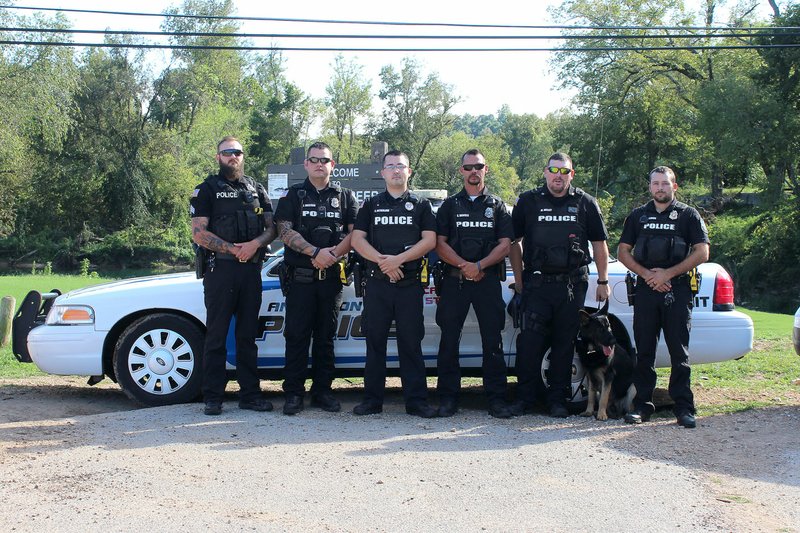 MEGAN DAVIS/MCDONALD COUNTY PRESS The Anderson Police Department includes Adam Miller (left), Justin Mustain, Chris Sutherland, Chief Seth Daniels, Mike Willet with K-9 Samson, and Aaron Lemon.
