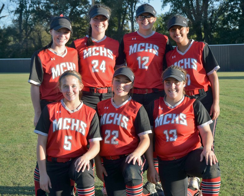 RICK PECK/SPECIAL TO MCDONALD COUNTY PRESS Seven senior members of the 2019 McDonald County High School softball team were honored following the Lady Mustangs' 5-1 win over Monett on Oct. 8 at MCHS. Seniors pictured are Emily Emmert (front, left), Kristin Cornell, Whitney Kinser, Caitlin Hall (back, left), Jackie Grider, Kaylee Eberley and Rita Santillan.