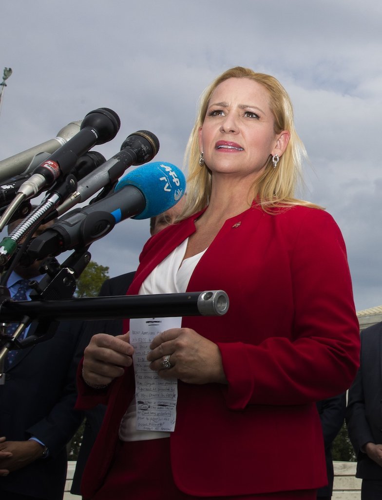 Arkansas Attorney General Leslie Rutledge speaks to reporters in front of the U.S. Supreme Court in Washington on Sept. 9. - Photo by The Associated Press