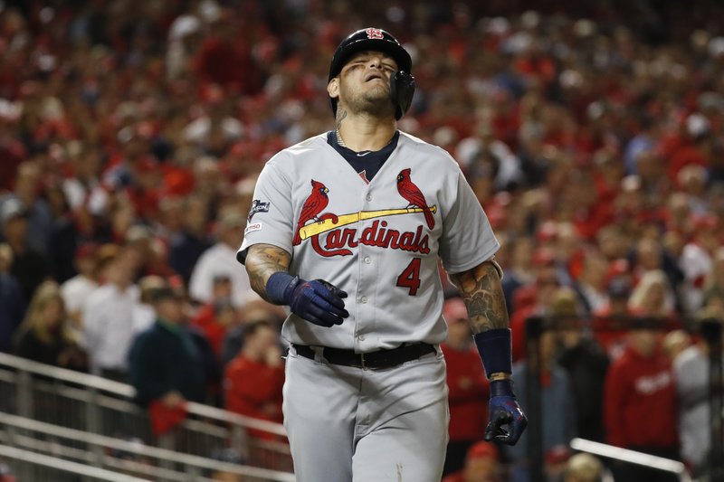 St. Louis Cardinals' Yadier Molina reacts after being hit by a pitch during the eighth inning of Game 4 of the baseball National League Championship Series against the Washington Nationals Tuesday, Oct. 15, 2019, in Washington. (AP Photo/Jeff Roberson)