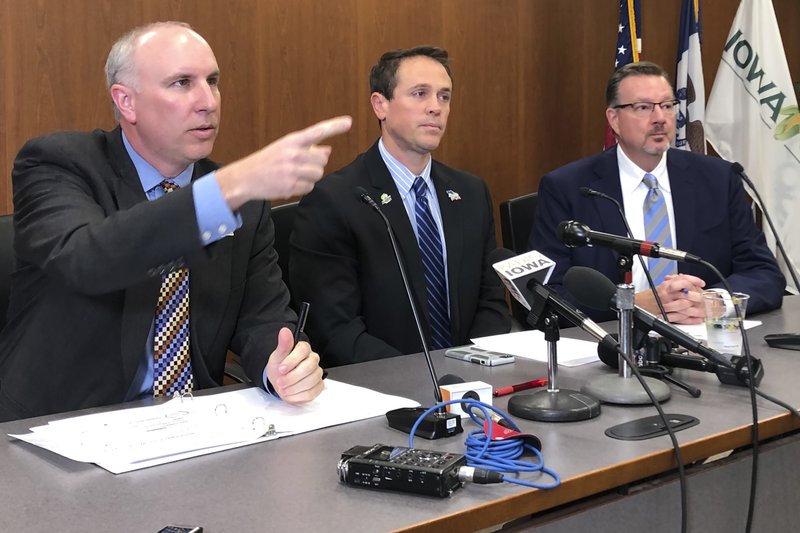 Monte Shaw, executive director of the Iowa Renewable Fuels Association; Grant Kimberley, executive director of the Iowa Biodiesel Board and Craig Floss, CEO of the Iowa Corn Growers Association hold a press conference at the Iowa Corn headquarters in Johnston, Iowa, on Wednesday, Oct. 16, 2019. They expressed disappointment and anger at the Trump administration for a new EPA biofuels rule they say does not uphold an agreement they had with Trump on Oct. 4 on the level of ethanol of biofuels to be blended into the nation's fuel supply. (AP Photo/David Pitt)