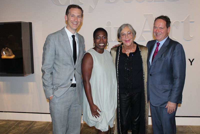 NWA Democrat-Gazette/CARIN SCHOPPMEYER Alice Walton, Crystal Bridges Museum of American Art founder and board chairwoman (third from left), welcomes patrons to the Oct. 10 preview of Crystals in Art: Ancient to Today with Rod Bigelow, the museum&#x2019;s executive director and chief diversity and inclusion officer (from left); Lauren Haynes, curator of contemporary art; and Joachim Pissarro, Hunter College Galleries director and Crystals co-curator.