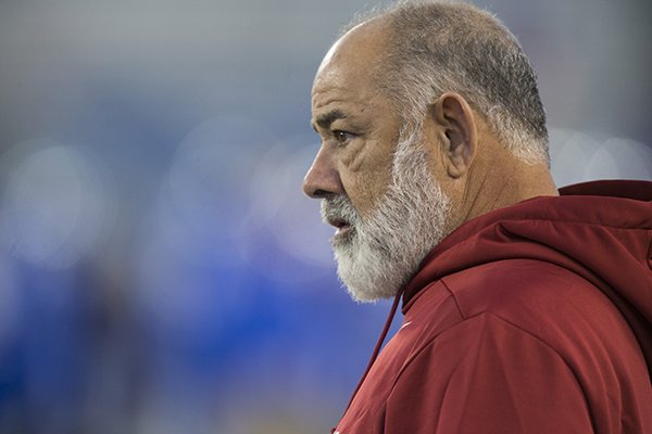 Arkansas defensive coordinator John Chavis watches pregame warmups prior to a game against Kentucky on Saturday, Oct. 12, 2019, in Lexington, Ky. 