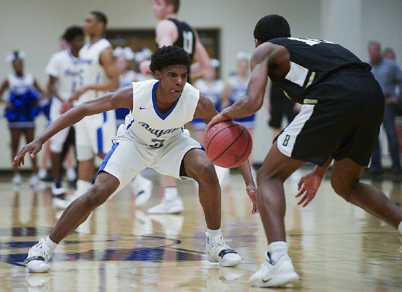 NWA Democrat-Gazette/CHARLIE KAIJO Bryant High School Khalen Robinson (2) covers Bentonville High School Connor Deffebaugh (10) during a basketball game, Saturday, March 2, 2019 at Bentonville West High School in Centerton. 

